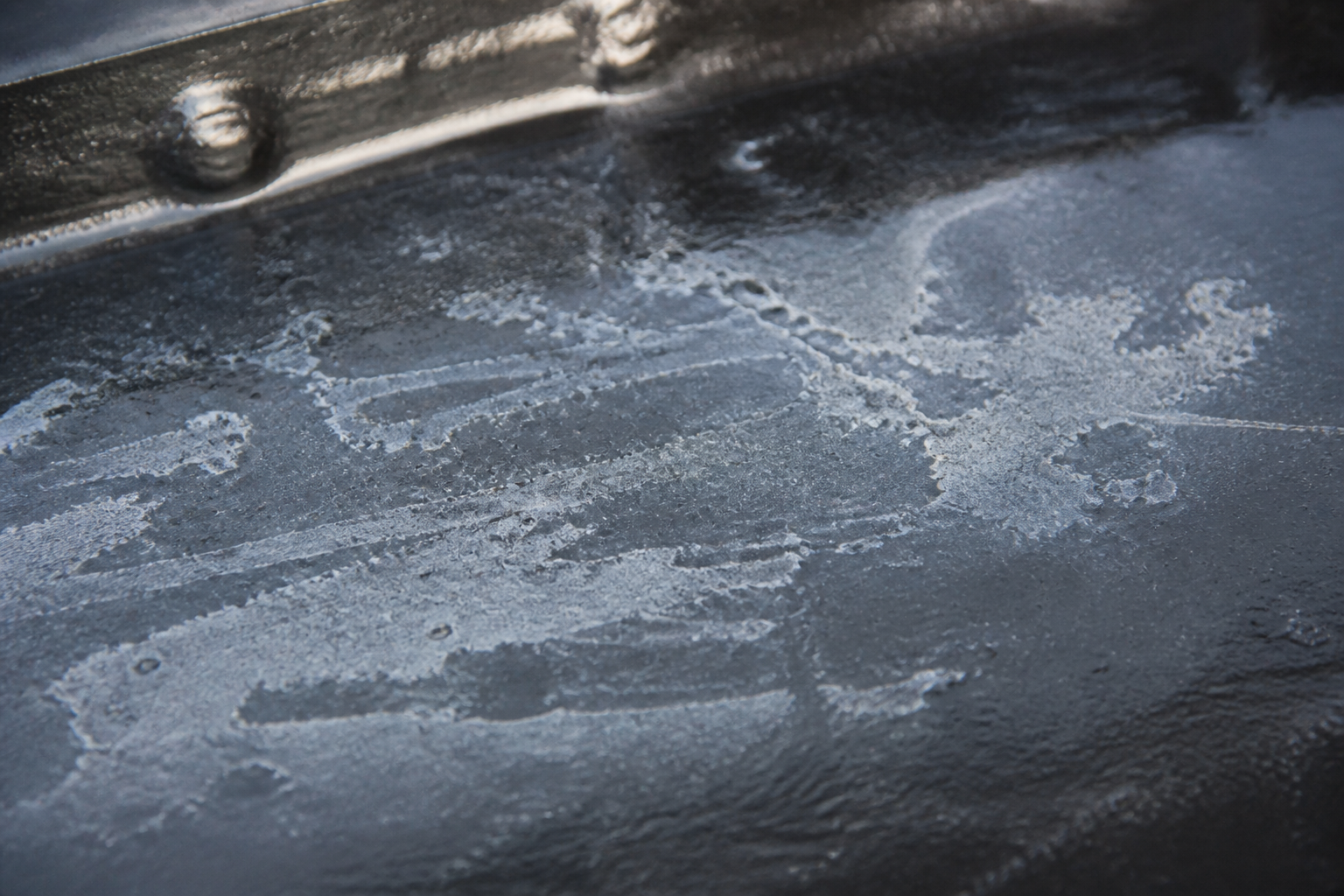 Photorealistic illustrative reference showing amine blush on a protective coating system
