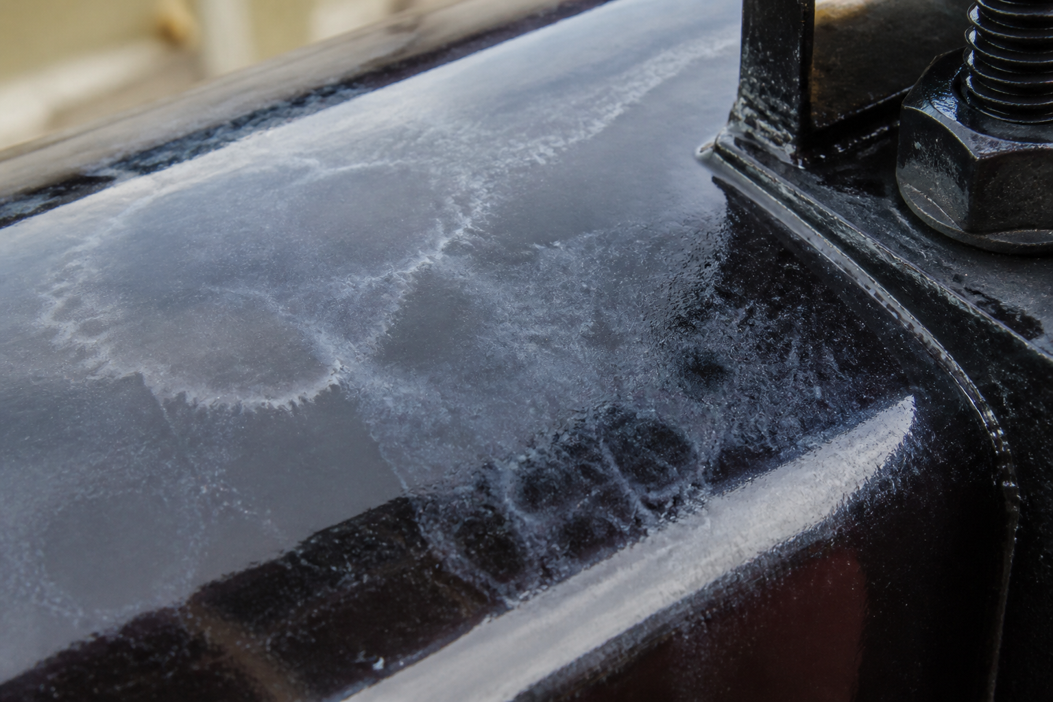 Photorealistic illustrative reference showing blooming on a protective coating system