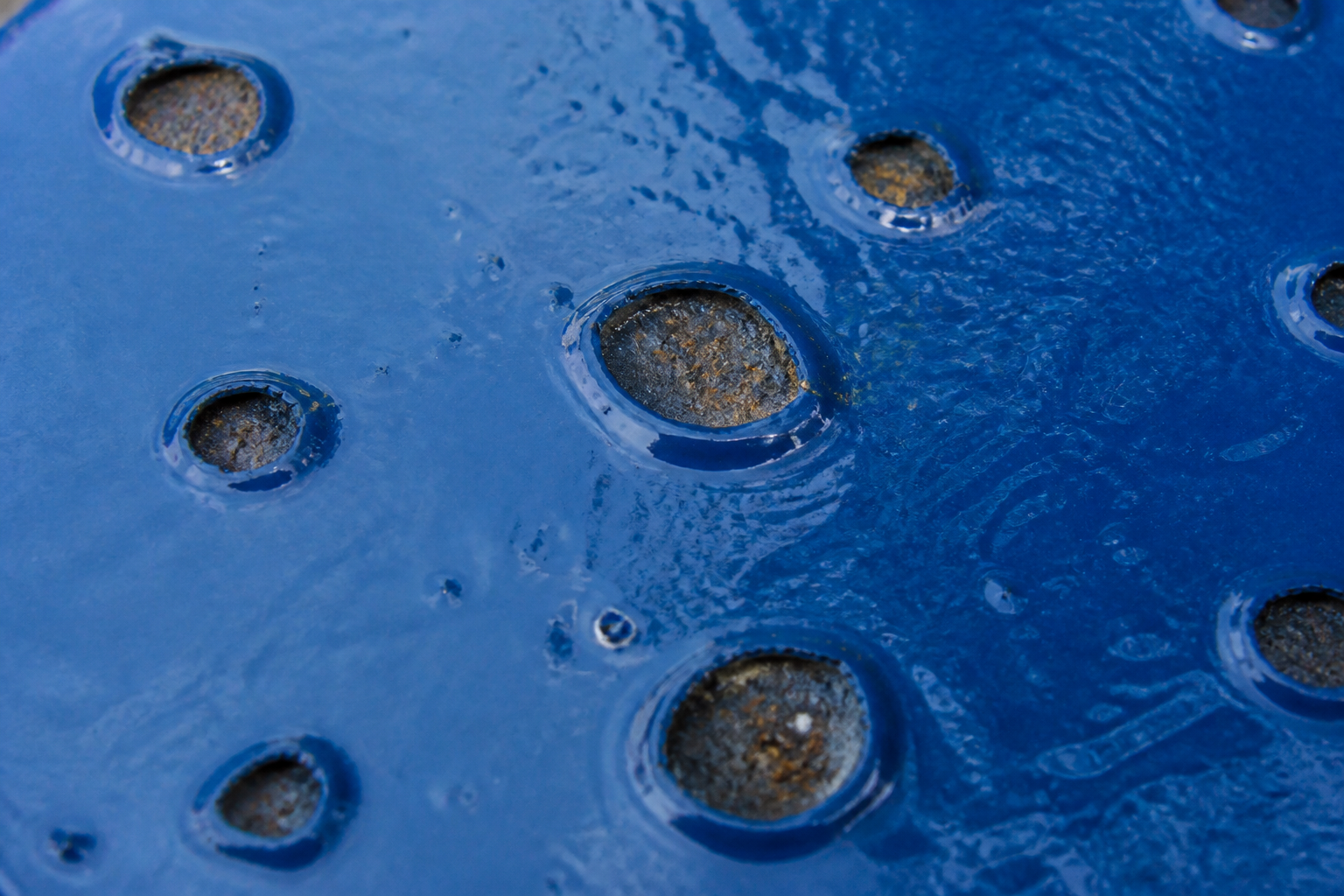 Photorealistic illustrative reference showing cratering on a protective coating system