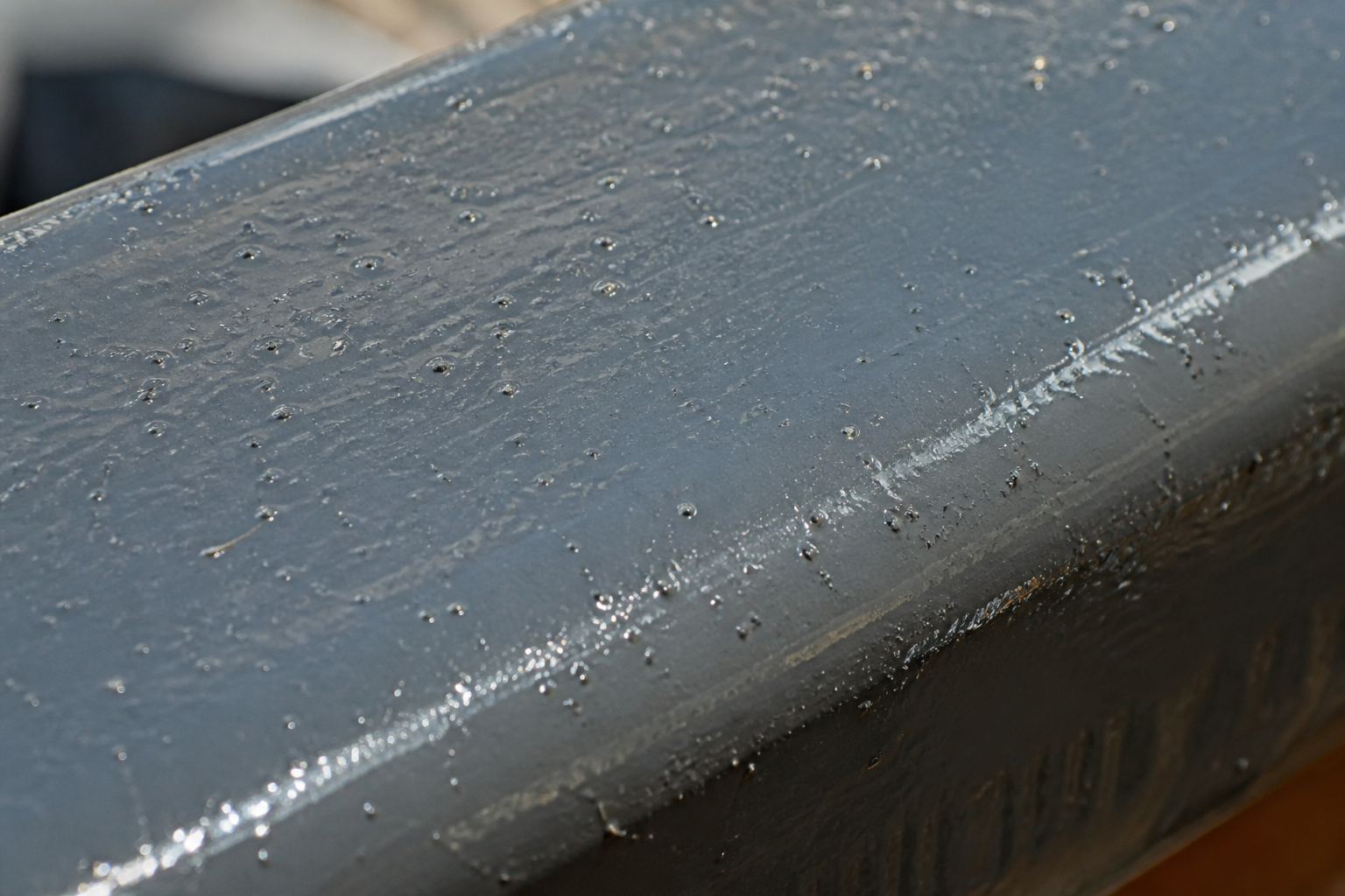Photorealistic illustrative reference showing dust inclusion on a protective coating system