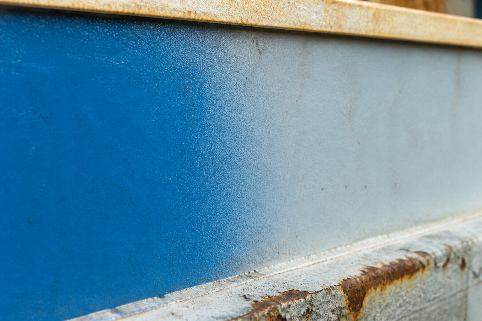Photorealistic illustrative reference showing fading on a protective coating system