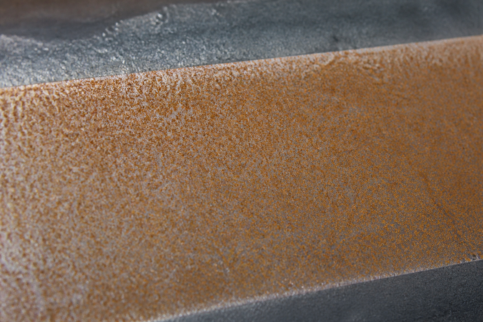 Photorealistic illustrative reference showing flash rusting on a protective coating system