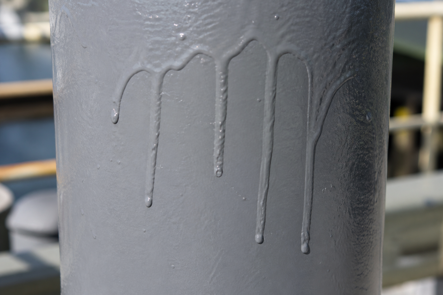 Photorealistic illustrative reference showing runs on a protective coating system
