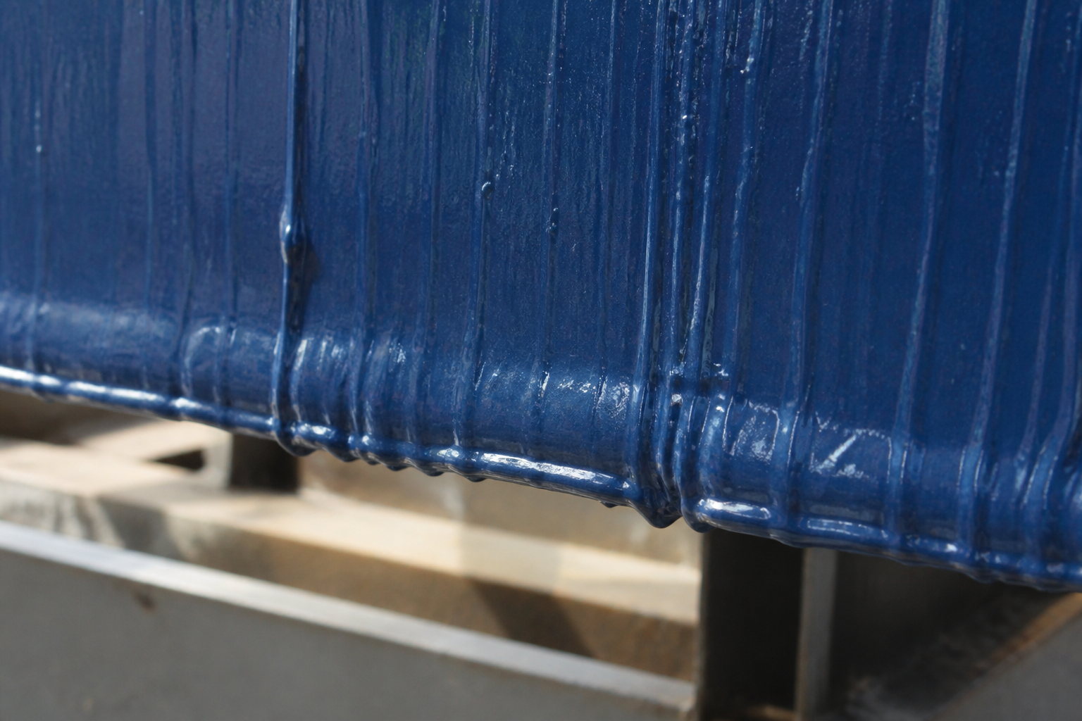 Photorealistic illustrative reference showing sagging on a protective coating system