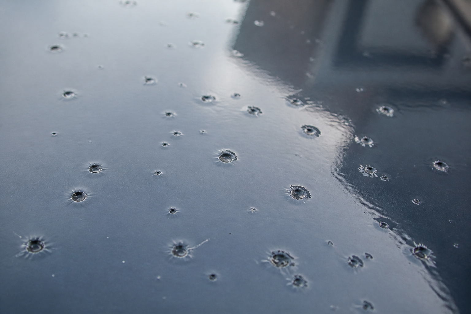 Photorealistic illustrative reference showing solvent popping on a protective coating system