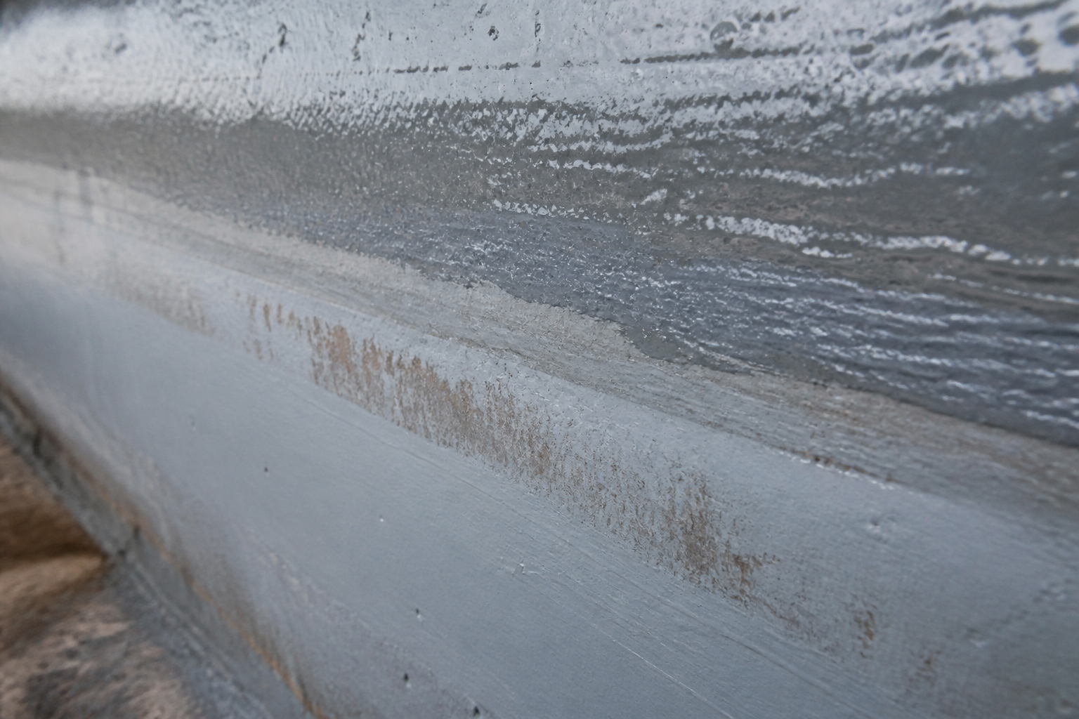 Photorealistic illustrative reference showing uneven dft on a protective coating system