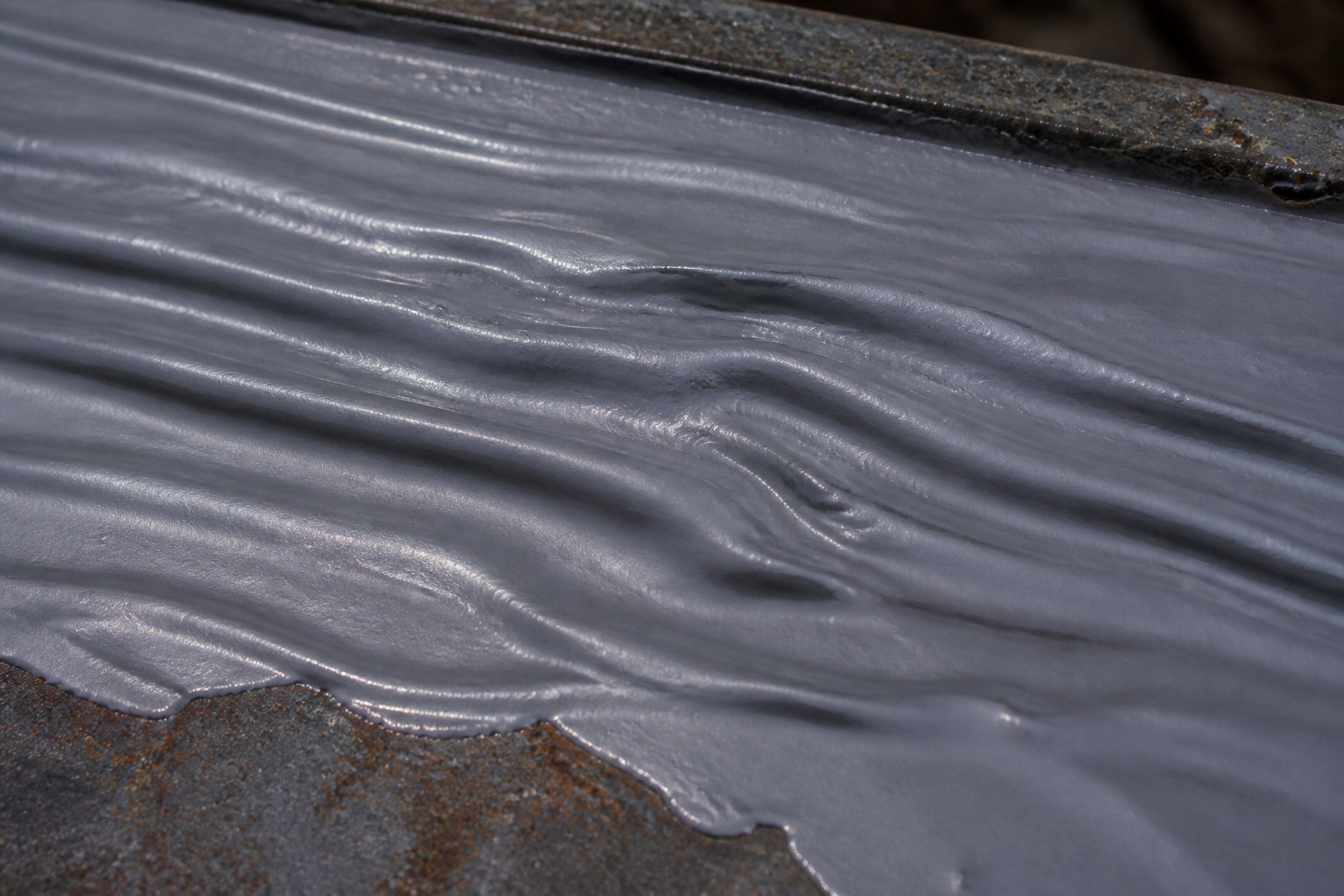 Photorealistic illustrative reference showing wrinkling on a protective coating system