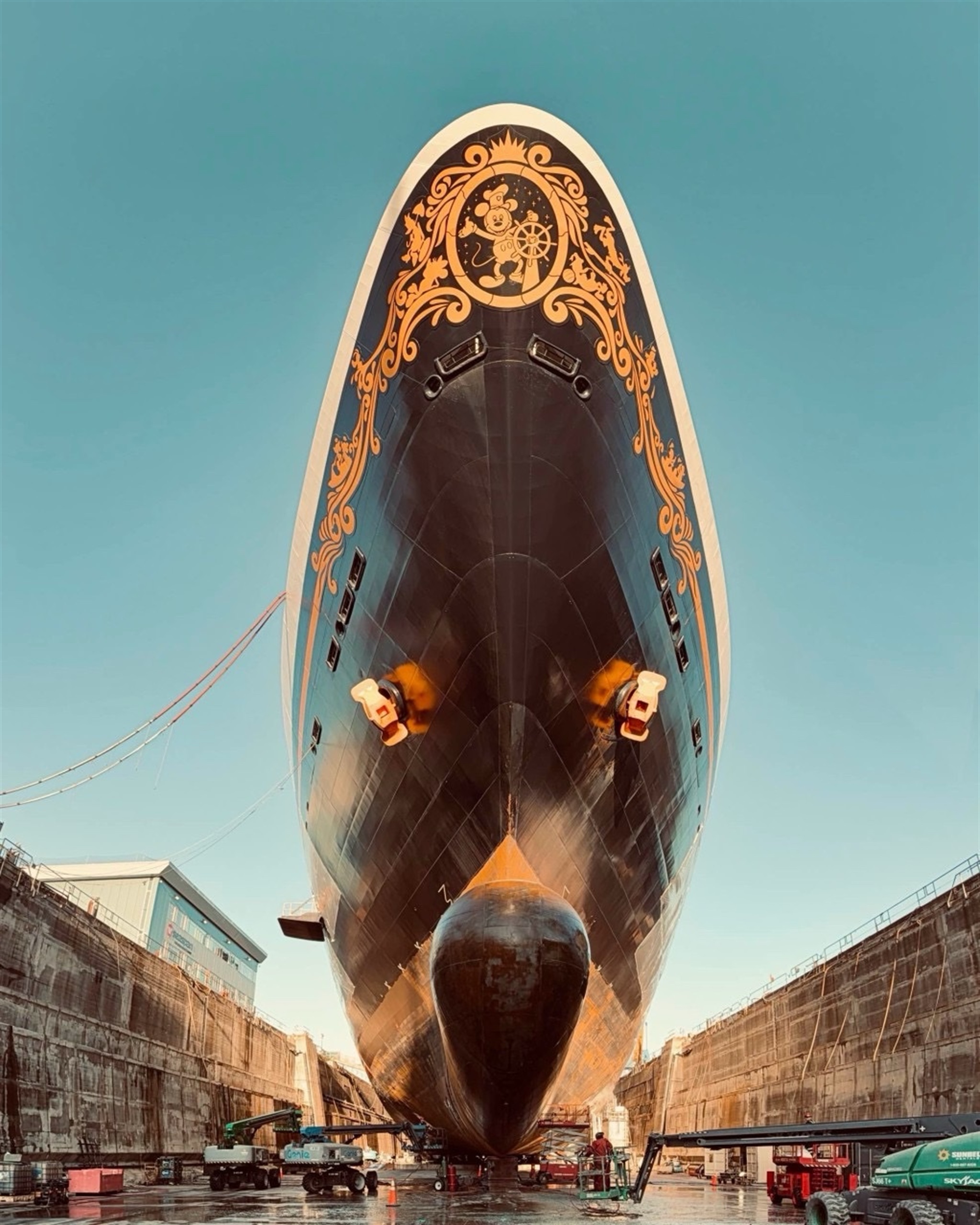 Cruise vessel bow undergoing drydock maintenance and coating work